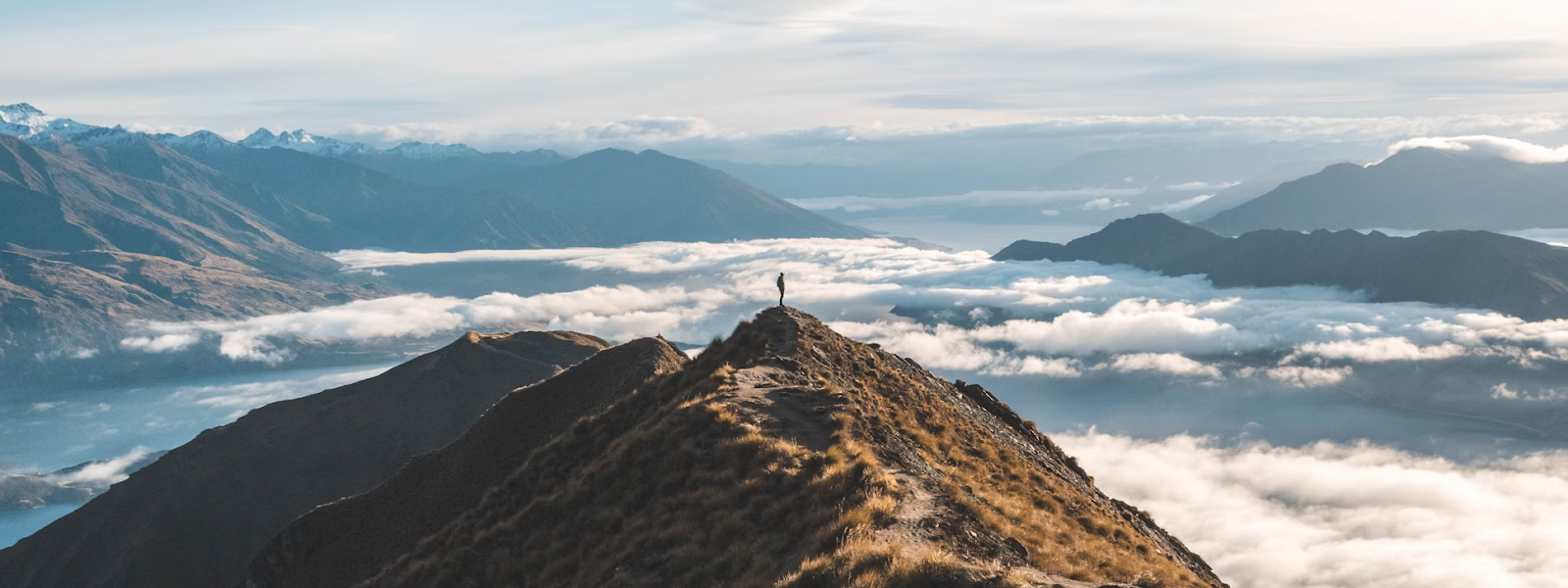 The Man Stands at the Summit